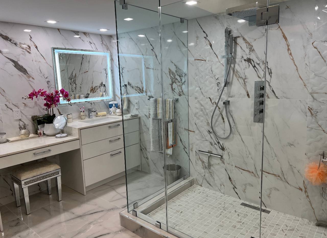 Calacatta marble bathroom with floating vanity and LED mirror